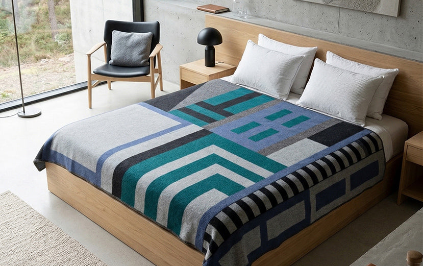 Hotel blanket on a bed